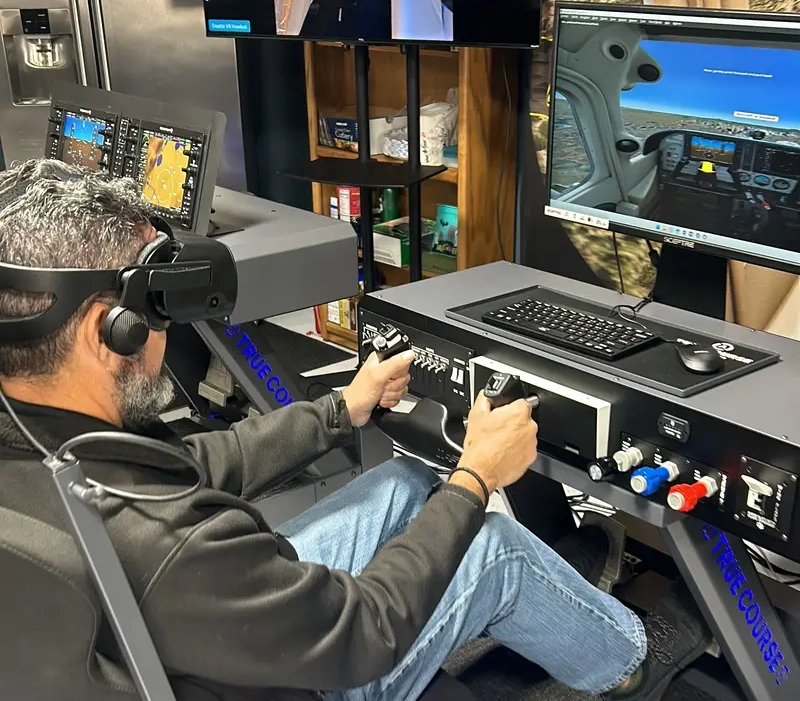 vr-flight-training-skills-student-pilot-vr-flight-simulator Student pilot using VR headset to simulate emergency procedures in flight training